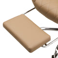 Close-up of tan PU leather retractable footrest pad with chrome support arm and diamond-stitch seat visible in background