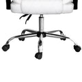 Close-up of chrome five-star base with five casters on white PU diamond-stitch executive office chair on white background