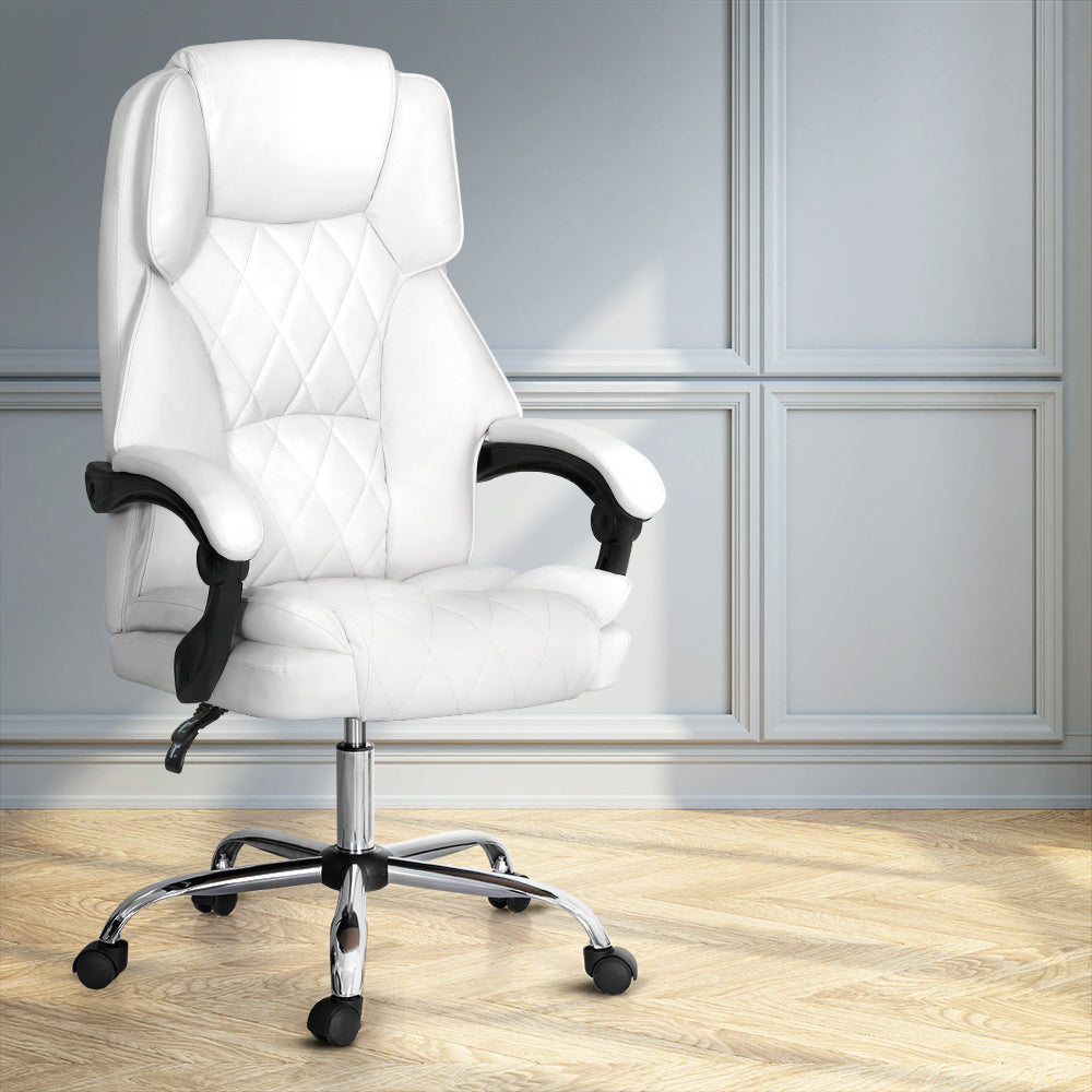 White PU diamond-stitch high-back executive chair with chrome base in room with grey panelled walls and wood floor