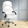 White PU diamond-stitch high-back executive chair with chrome base in room with grey panelled walls and wood floor