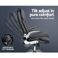 Black PU flip-arm executive chair side view on dark grey background showing tilt adjustment range and 360-degree swivel