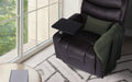 Top view of dark brown PU leather recliner with swivel tray table extended, green cushion and throw, by window