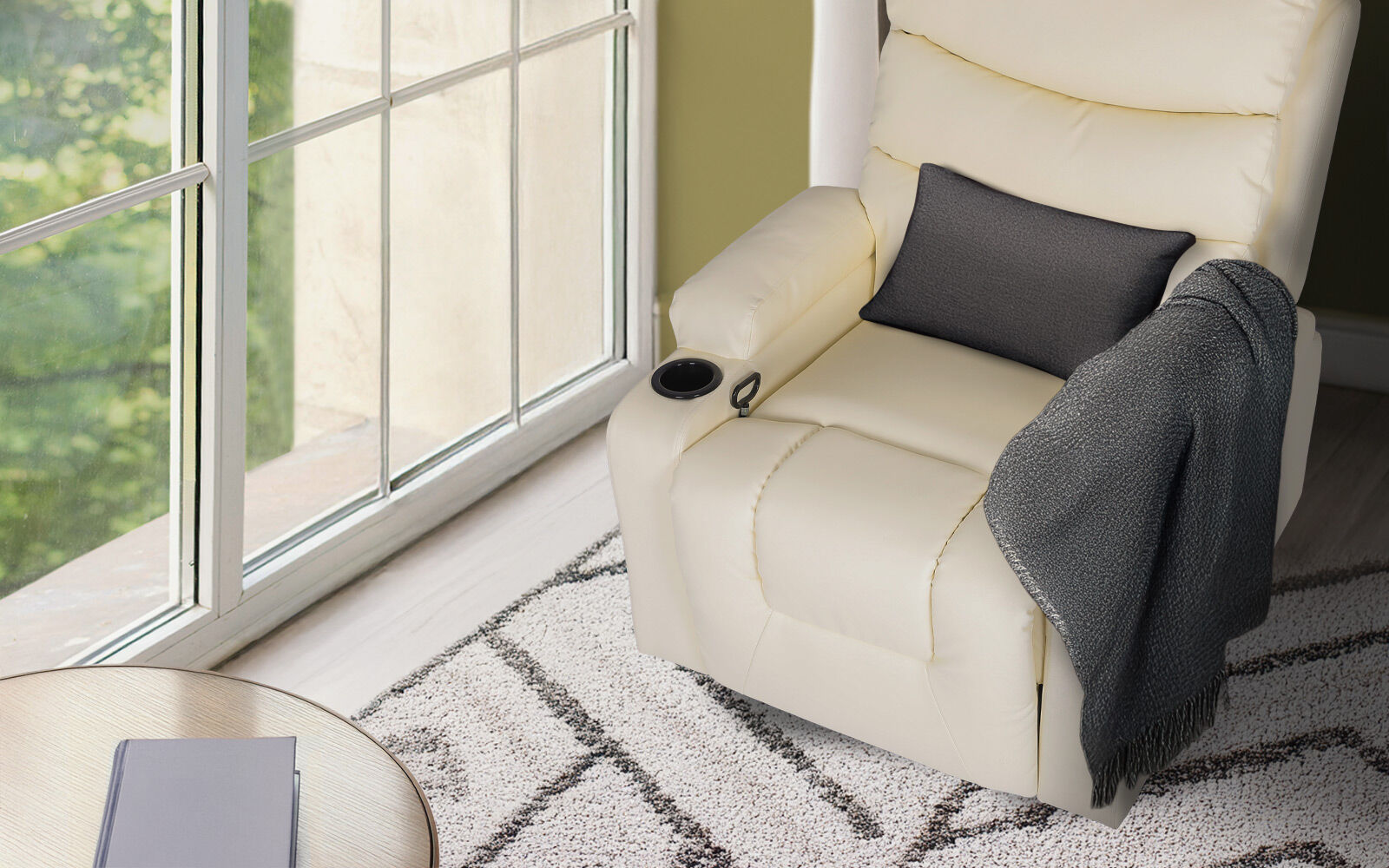 Cream PU leather recliner upright beside large window with dark grey cushion and throw, cup holder, patterned rug