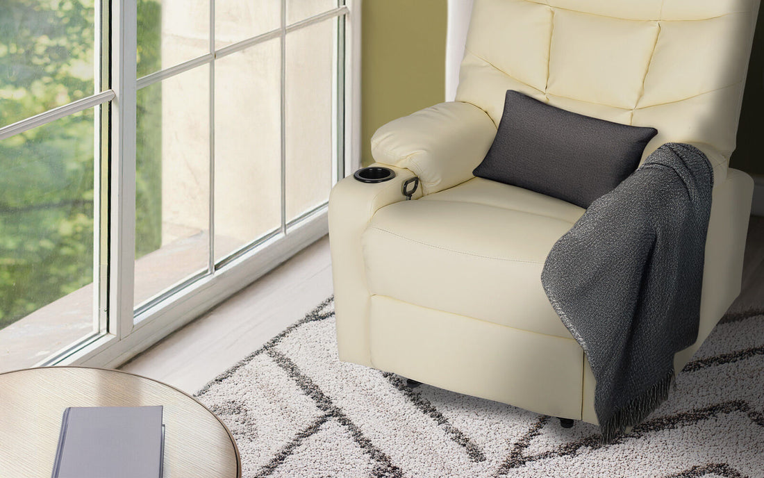 Cream PU leather recliner with tufted backrest, two cup holders and side pocket, angle view on white background