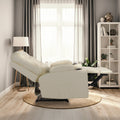 Cream tufted PU recliner fully reclined with footrest extended, side view in living room with bookshelf and floor lamp