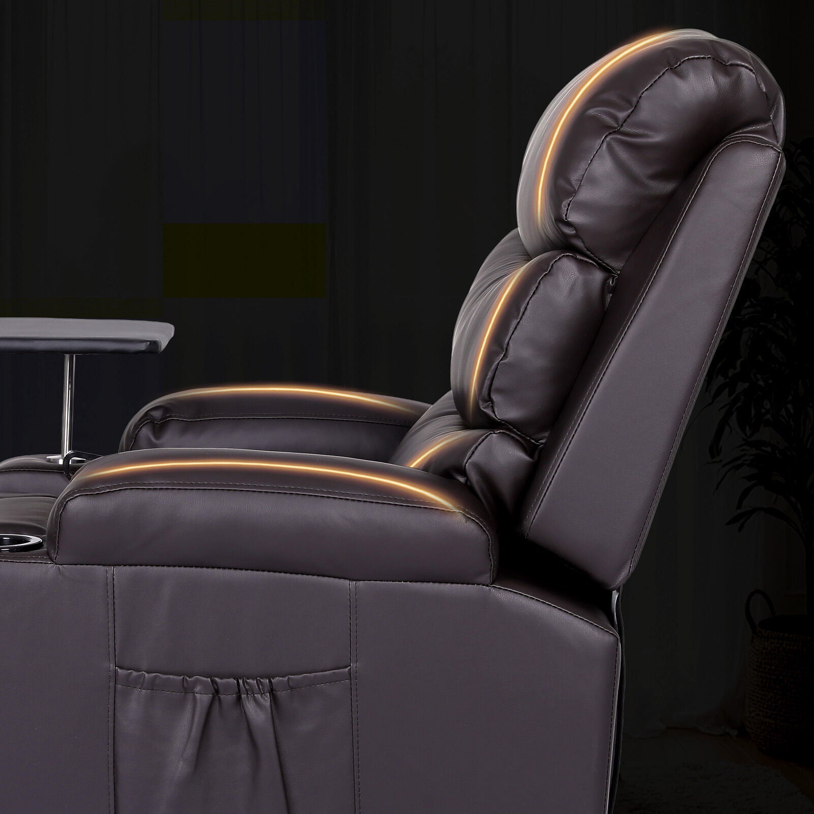 Close-up of dark brown PU leather recliner side view with amber glowing massage indicators along seat seams, dark background