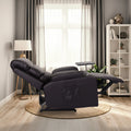 Dark brown PU leather recliner fully reclined with footrest extended and swivel tray, side view in living room with bookshelf