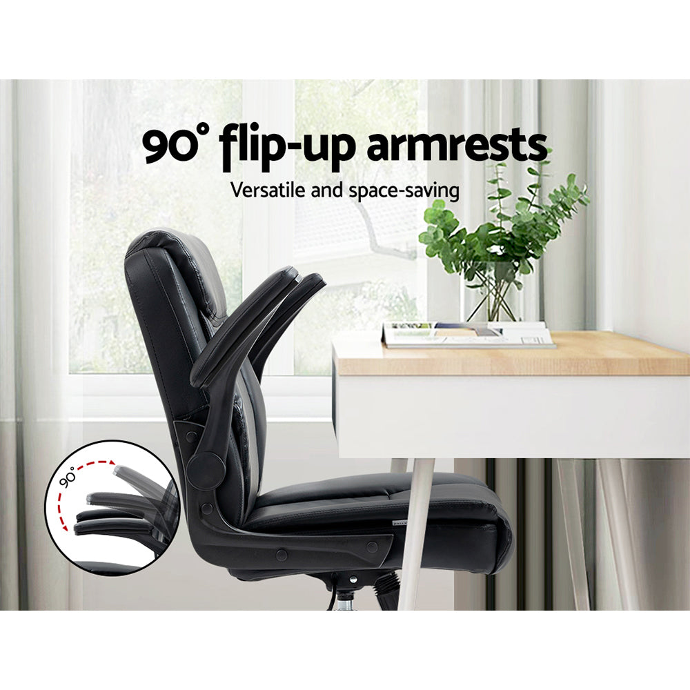 Black PU mid-back chair side view with 90-degree flip-up armrests raised next to white desk, 90-degree arc circle inset