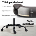 Dark brown PU mid-back chair seat showing PU leather, 10cm high-density foam and wooden board with black metal base
