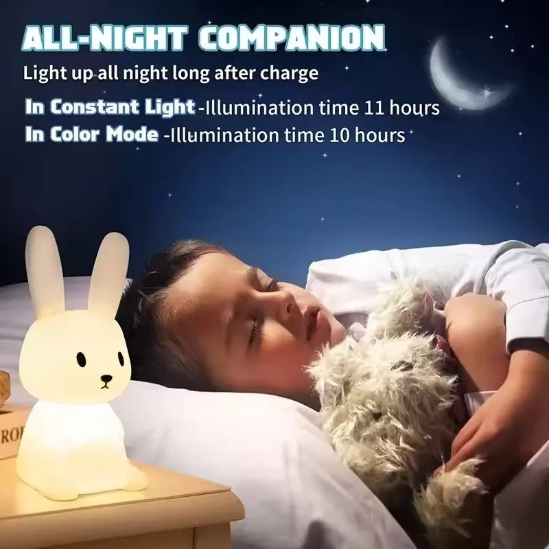Child sleeping with rabbit night light on bedside table, text All-Night Companion: Constant Light 11 hrs, Color Mode 10 hrs