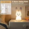 Silicone rabbit night light glowing warm on bedside table, size inset 8in tall 3.7x3.6in, text 3 Hours Timing Mode USB Type-C