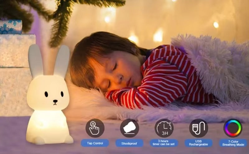 Rabbit night light glowing beside sleeping child in red pyjamas; icons: Tap Control, 3H timer, USB Rechargeable, 7-Color mode