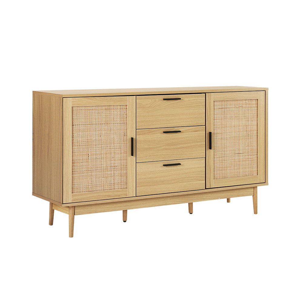 Natural wood sideboard with two rattan panel doors and three central drawers on angled white background view