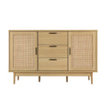 Natural wood and rattan sideboard with two cane doors and three central drawers, straight front view on white background