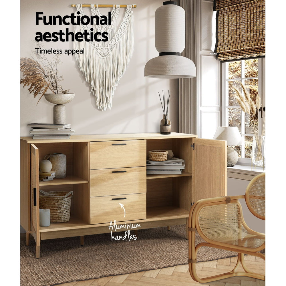 Rattan sideboard open in boho room showing shelves with baskets and books, labelled 'Aluminium handles'