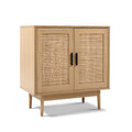 Natural oak rattan sideboard cabinet with two doors closed, three-quarter angle view on white background
