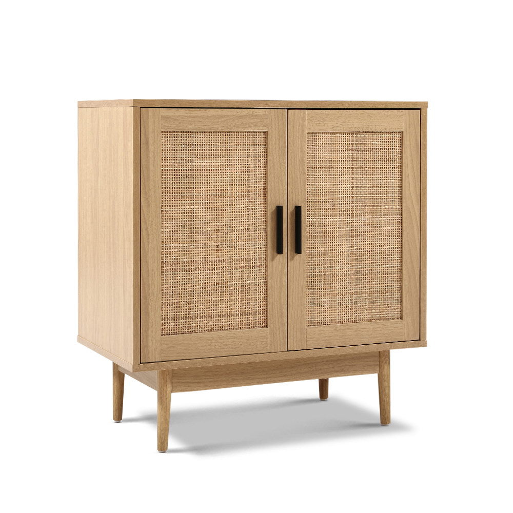 Natural oak rattan sideboard cabinet with two doors closed, three-quarter angle view on white background