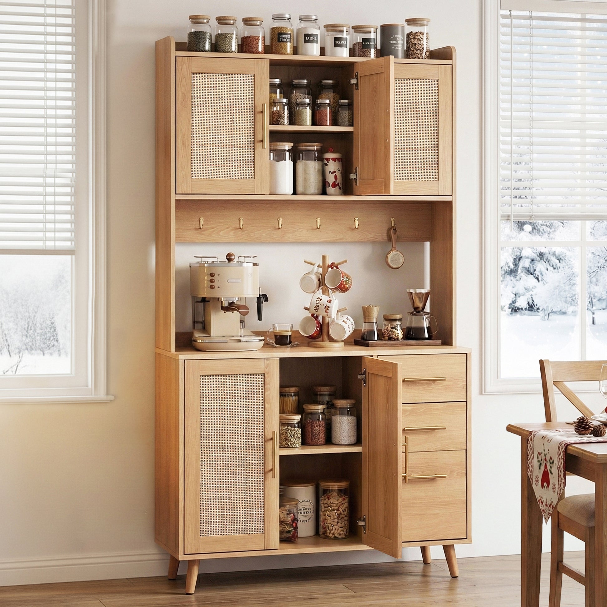 Rattan sideboard hutch open in kitchen with spice jars on top, dishes in upper cabinet, coffee machine on counter