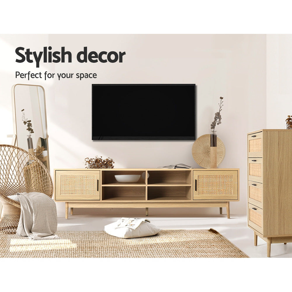 Rattan TV stand 180cm in boho living room below wall-mounted TV with rattan chair mirror and wicker basket