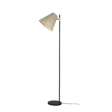 Floor lamp with natural rattan conical shade tilted left, slim black pole, gold brass pivot connector, round flat black base