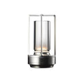 Silver retro lantern LED table lamp with rectangular metal frame and cylindrical glass tube on white background