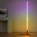 RGB bar floor lamp with rainbow gradient casting purple and yellow glow on wall, styled next to white console table