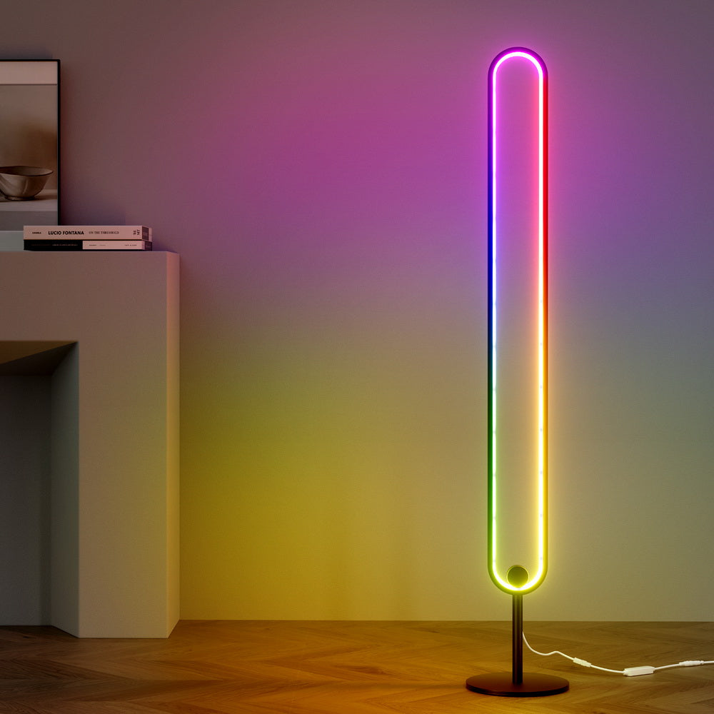 RGB oval floor lamp with rainbow spectrum glow in room, purple wall above and yellow below, white console table alongside