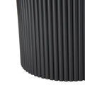Close-up of black fluted cylindrical pedestal base of round coffee table showing ribbed tube detail