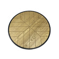 Top-down view of round coffee table showing oak sunburst geometric pattern with radiating triangular segments and black border