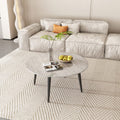Round marble-effect coffee table in front of grey modular sofa on woven rug, styled with magazine and fruit bowl