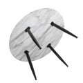 Underside of round marble-effect coffee table showing four black tapered legs with metal brackets, white background