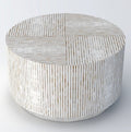 Round drum coffee table with vertical mother of pearl mosaic tile cladding and four-quadrant patterned top photographed from