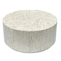 Round drum coffee table fully covered in vertical white and beige mother of pearl mosaic tiles with a metal base ring on