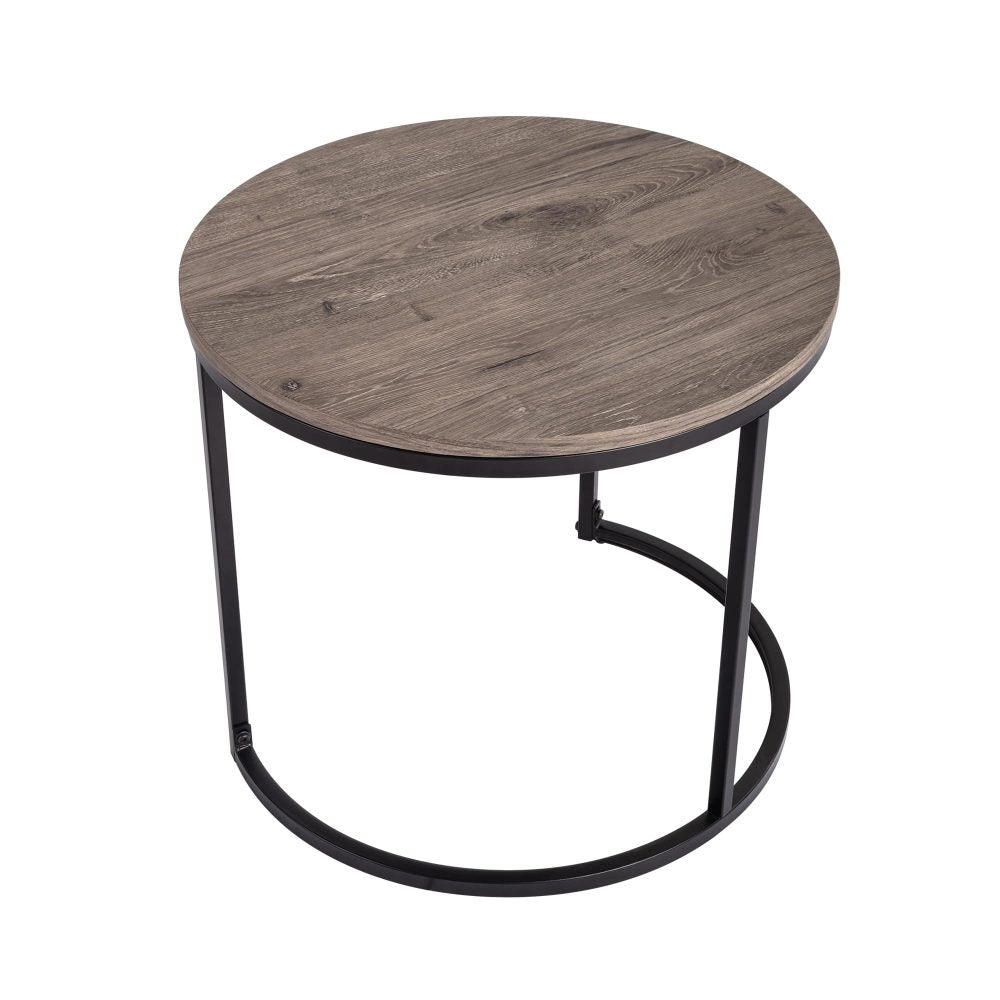 Large round nesting coffee table with grey-tone wood grain top and black metal ring base on white background