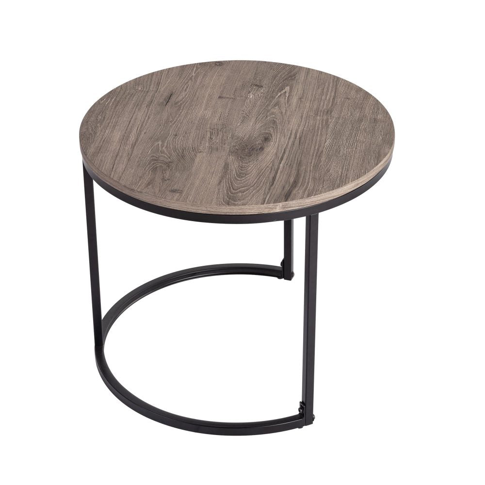 Small round nesting coffee table with grey-tone wood grain top and black C-shaped metal base on white background