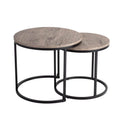 Two round nesting coffee tables with grey-tone wood tops and black circular metal ring bases on white background