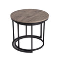 Large round coffee table with grey-tone wood top and black metal base with smaller table nested inside, white background
