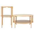 Round oak coffee table and cylindrical side table with rope spindle sides and two-tier shelves from an angle on white