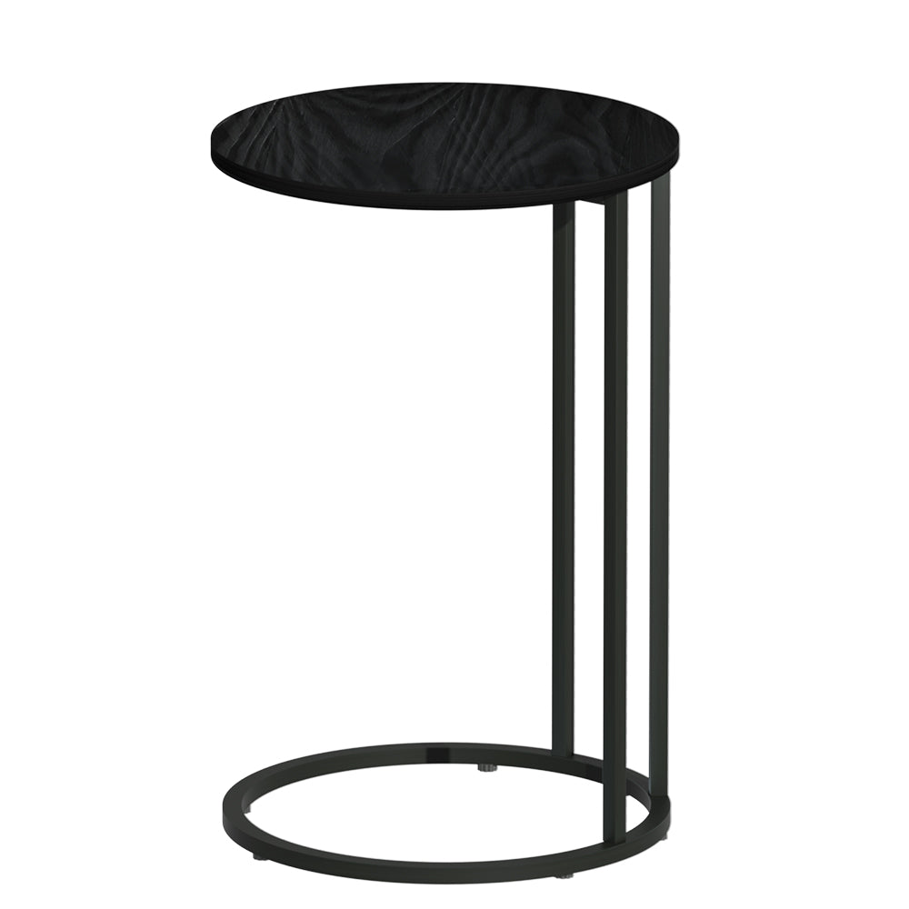 Round black side table front view on white background, wood-grain circular top, black metal posts and circular base ring