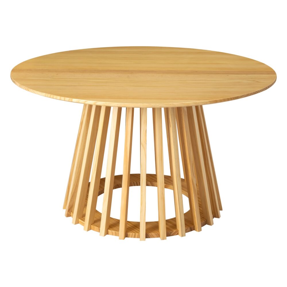 Round natural pine coffee table with splayed slatted wood pedestal base, styled in a living room with white tulips, books