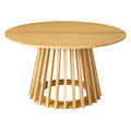 Round natural pine coffee table with flared slatted cylindrical pedestal base on white background, showing wood grain and