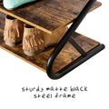 Close-up of matte black steel Z-frame end on rustic shoe rack with fringe boots on shelf and sturdy frame text