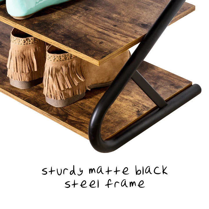 Close-up of matte black steel Z-frame end on rustic shoe rack with fringe boots on shelf and sturdy frame text