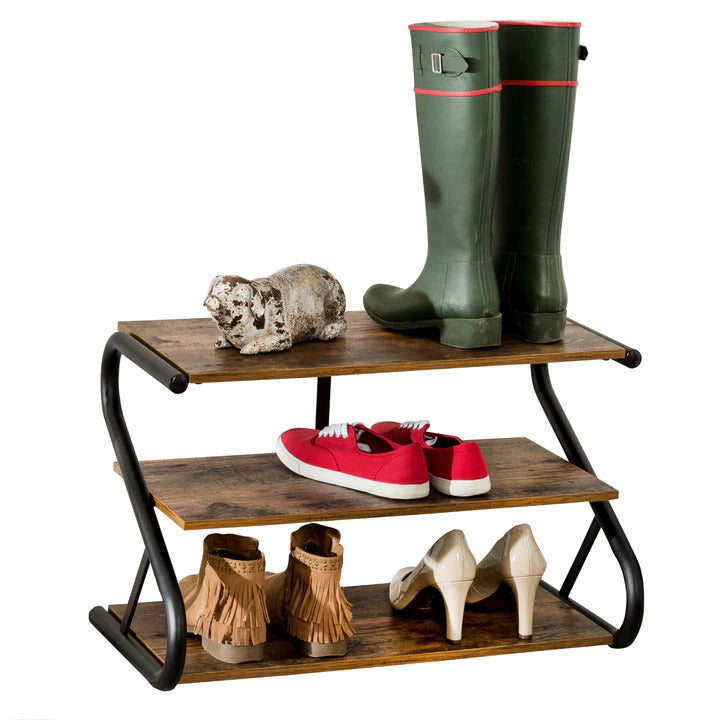 Rustic industrial 3-tier shoe rack on white background with boots red sneakers and fringe boots on shelves