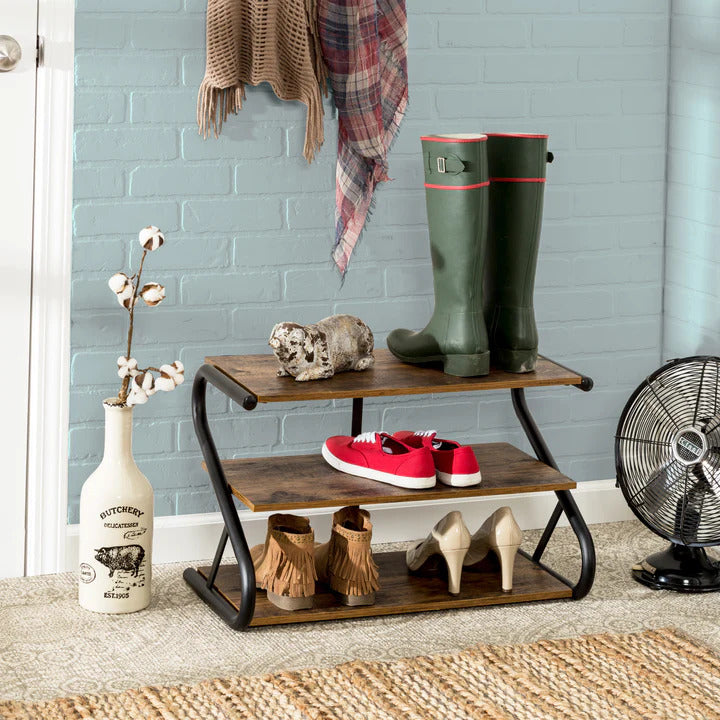 Rustic industrial 3-tier shoe rack with Z-shaped black steel frame and brown wood shelves on white background