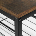 Close-up of rustic brown wood top corner meeting black metal frame on 4-tier industrial shoe rack
