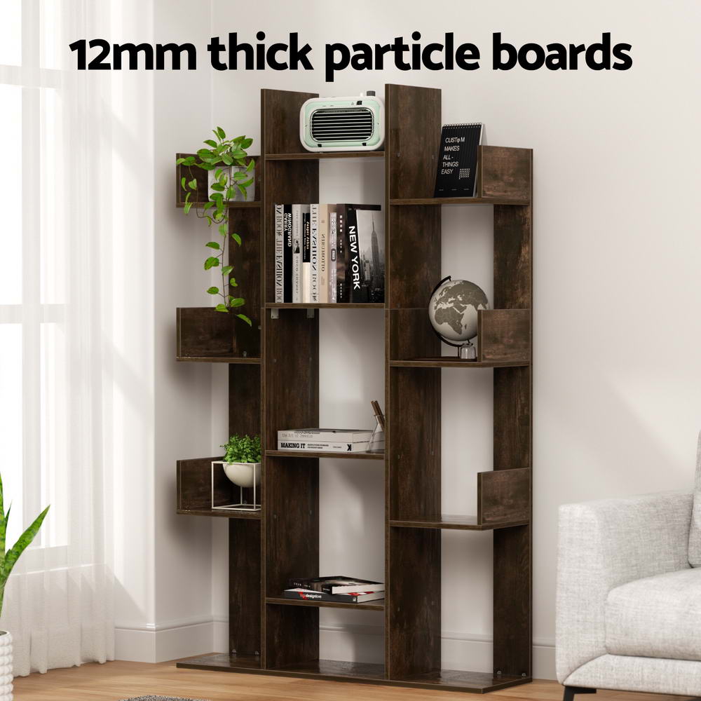 Dark brown tree bookcase with books and plants in a living room; text reads 12mm thick particle boards