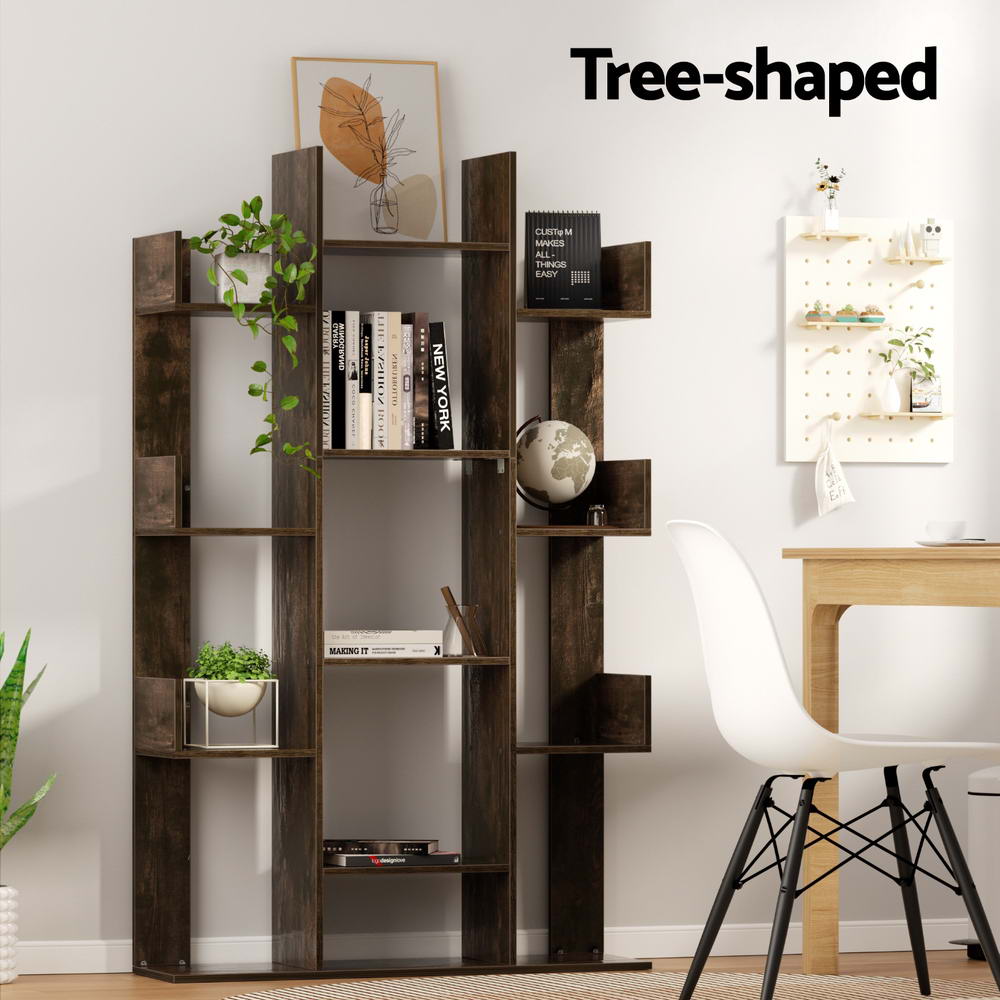 Dark brown tree-shaped bookcase styled with books, plants, and globe in a home study; text reads Tree-shaped