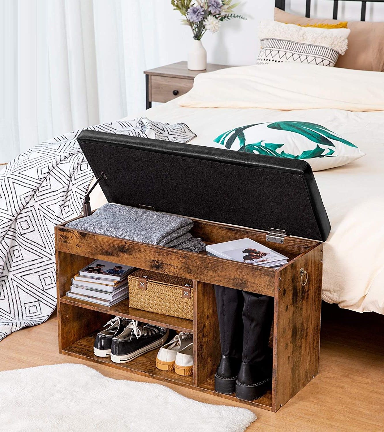 Rustic wood shoe bench with lid open showing hidden storage, shoes in lower cubbies, bedroom setting