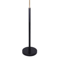 Close-up of matte black round base and cylindrical pole with gold brass connector, floor lamp on white background